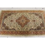 Small Indo-Persian rug with centre medallion and all over floral design, with multiple borders, (