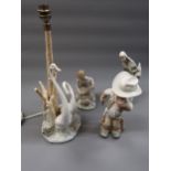 Lladro figure of a cowboy, two other Lladro figures and a Lladro style table lamp in the form of