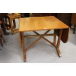 David Joel, Honey oak rectangular drop leaf side table, with crossover stretchers and twin splayed