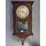 Small late 19th / early 20th Century walnut wall clock, with a painted dial and Roman numerals,