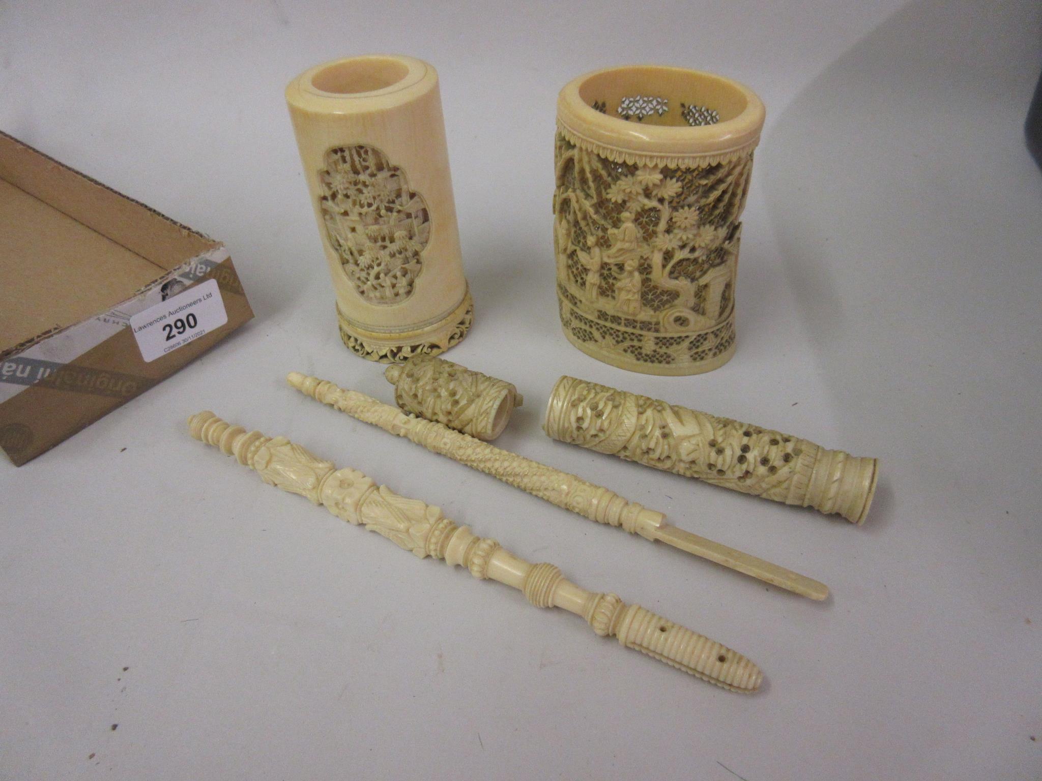 Two 19th Century Chinese carved ivory vases together with a needle case (at fault) and two carved