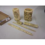 Two 19th Century Chinese carved ivory vases together with a needle case (at fault) and two carved