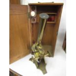 Late 19th / early 20th Century brass monocular microscope by Baker, London, in a fitted oak case,