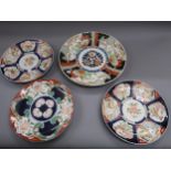 Imari charger decorated in iron red, blue and green, 15ins diameter together with three similar