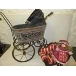 Doll's wickerwork and iron pram, modern bisque headed doll and a miniature dolls sofa, (at fault)