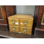 Mid 20th Century light oak four drawer index cabinet by Libraco, together with three oak and