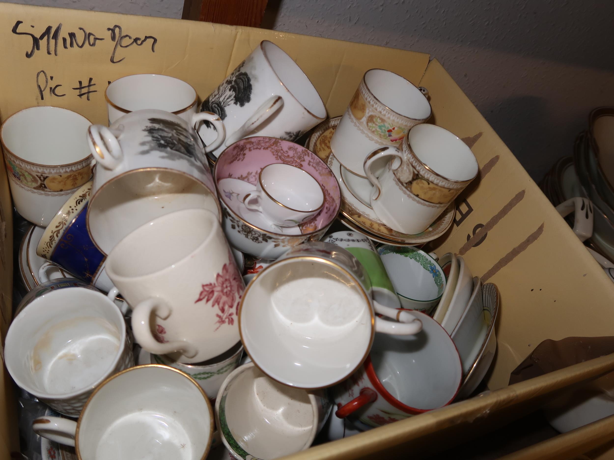 Box containing a quantity of miscellaneous decorative coffee cups and saucers