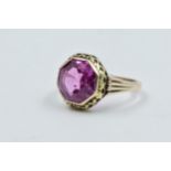 Continental yellow gold ring set hexagonal pink stone