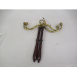 Pair of gilt brass and turned mahogany wig hangers