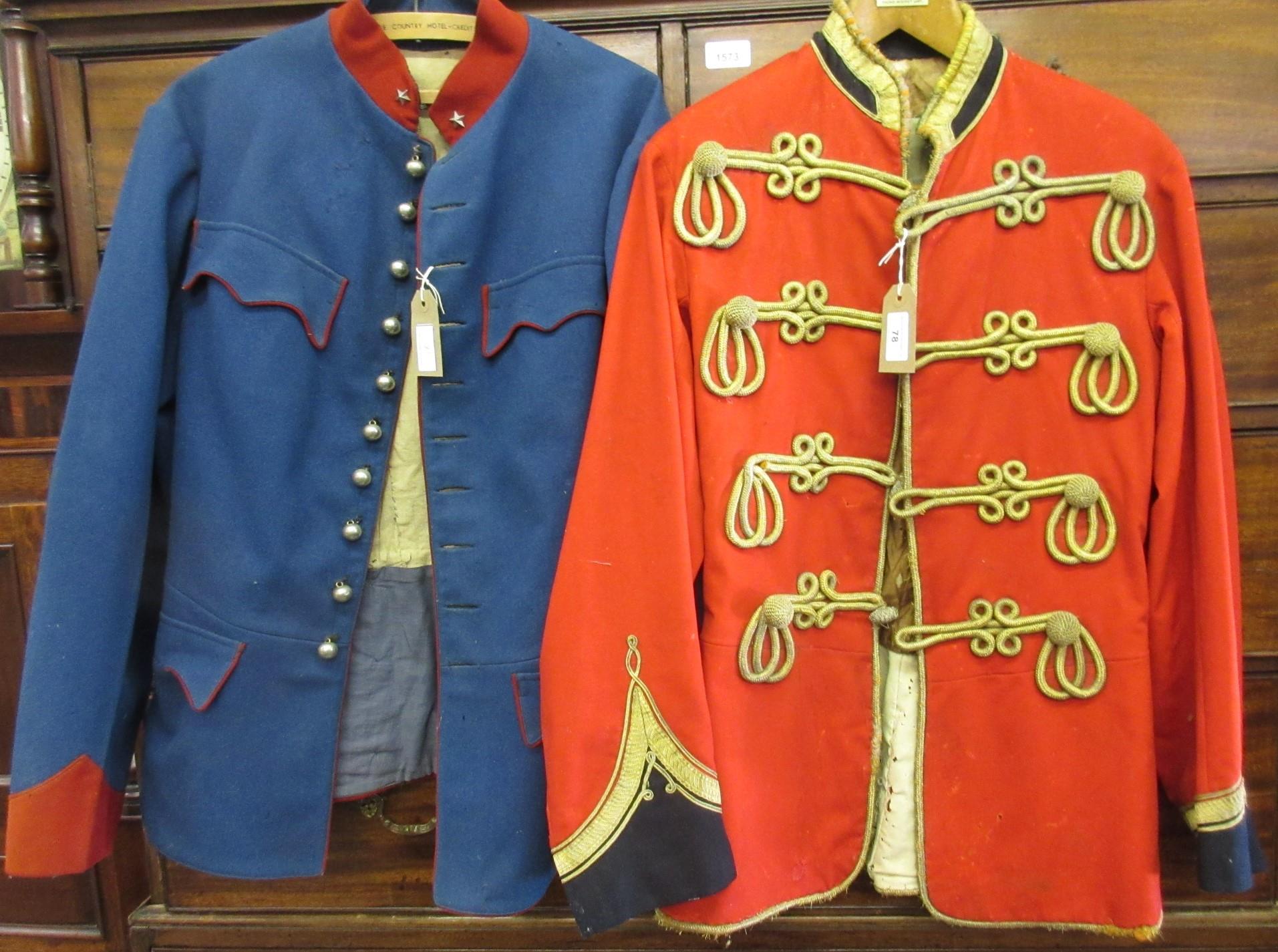 Red Military tunic decorated with gold braid, together with a similar continental blue military