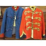 Red Military tunic decorated with gold braid, together with a similar continental blue military