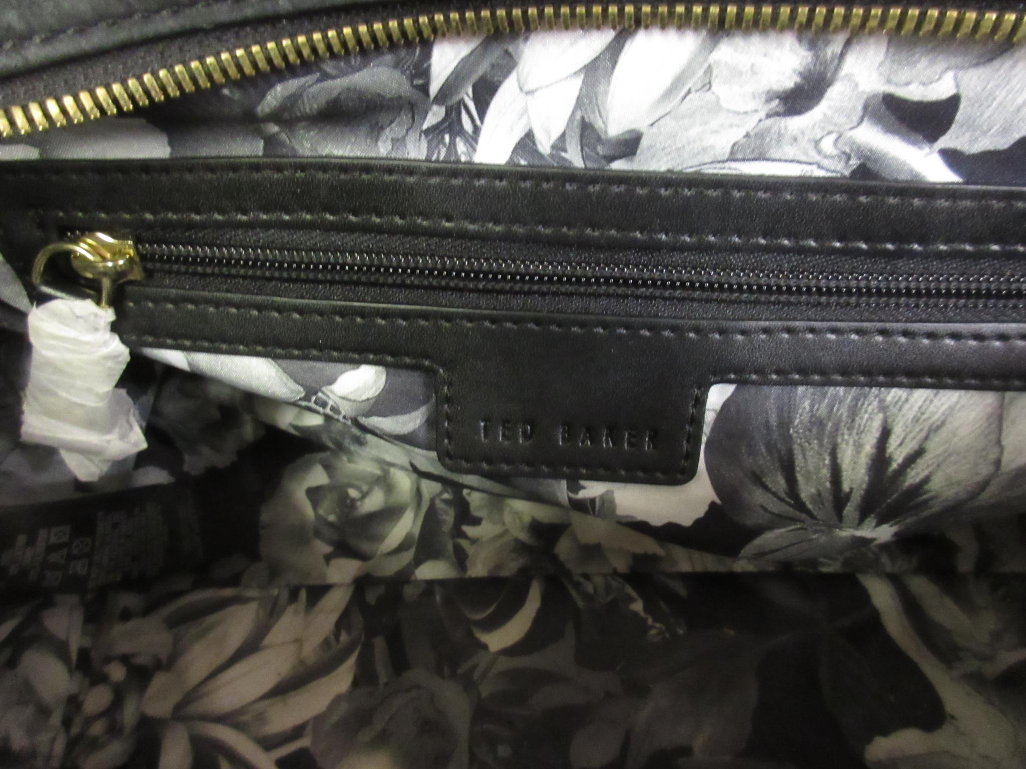Ted Baker, gilt brass mounted black leather handbag, with dust bag This bag has been used but is - Image 4 of 6
