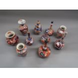 Five various small Imari bottle vases and five other small Imari vases, the tallest 7.5ins