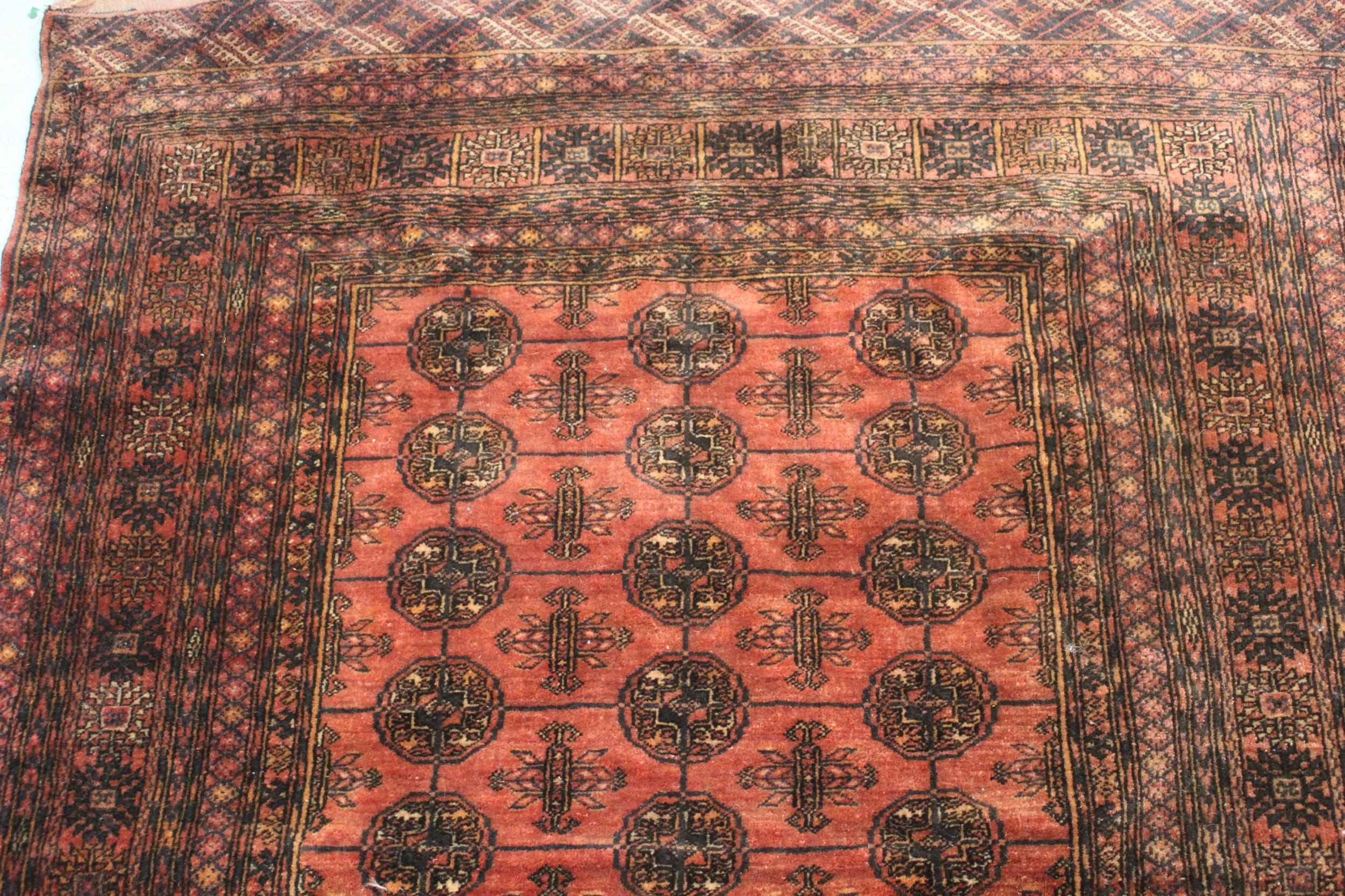 Modern Turkoman rug with three rows of ten gols on a wine ground, with multiple border, 6ft x 4ft - Image 3 of 4