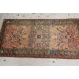 Hamadan rug of all-over floral design with multiple borders on a red ground, 80ins x 40ins