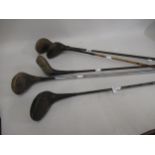 Five various golf clubs with steel and metal shafts