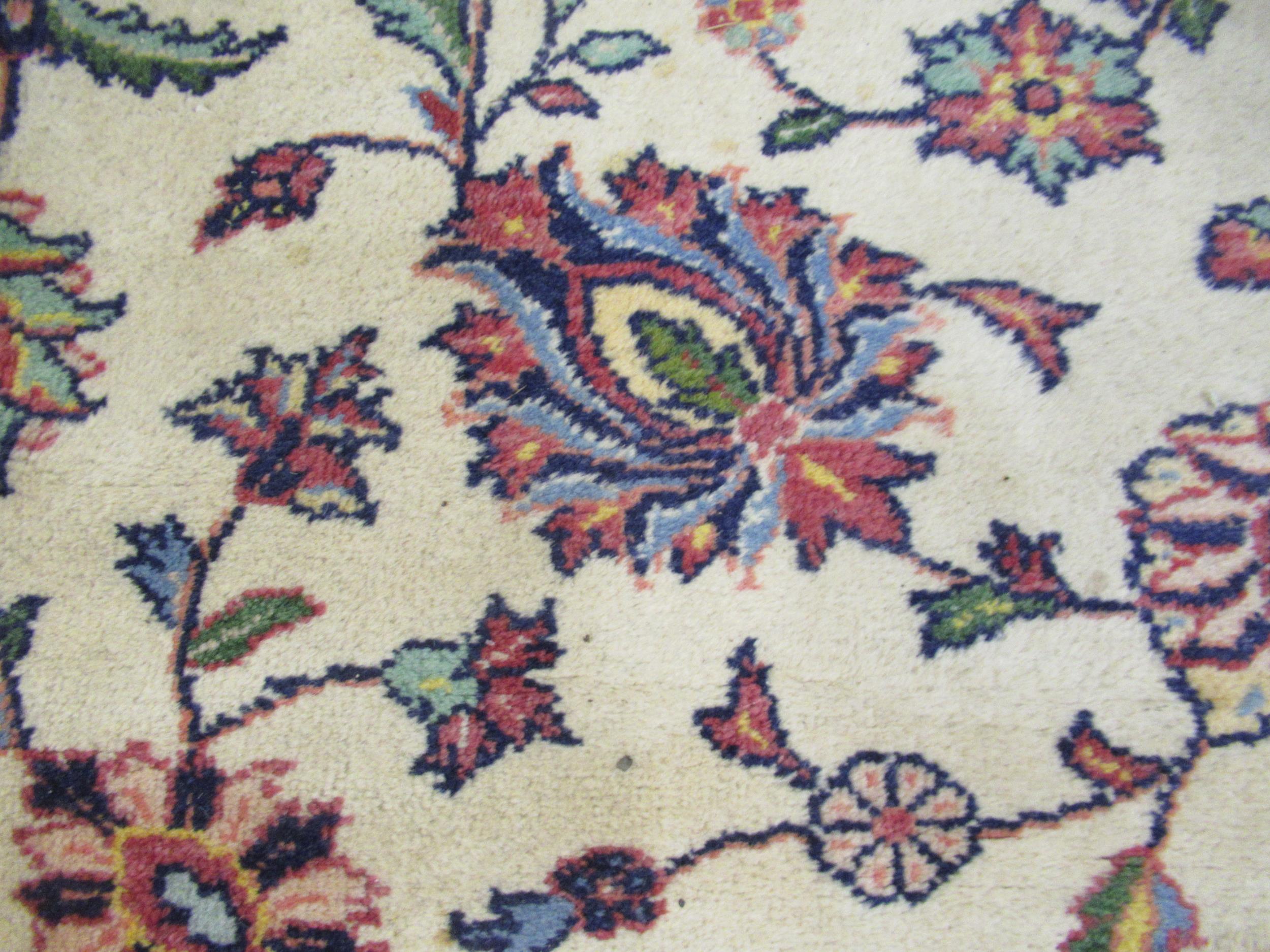 Indian carpet with an all over stylised floral design on ivory ground with pale blue borders, 140ins - Image 5 of 6