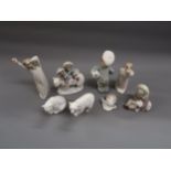 Lladro group of children riding a polar bear, another of a boy holding a football and six other