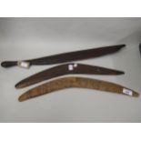 Two Aboriginal boomerangs, together with a native hardwood war club