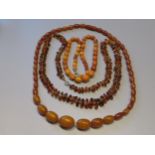 Small butterscotch amber bead necklace, together with two other amber necklaces and two amber ear