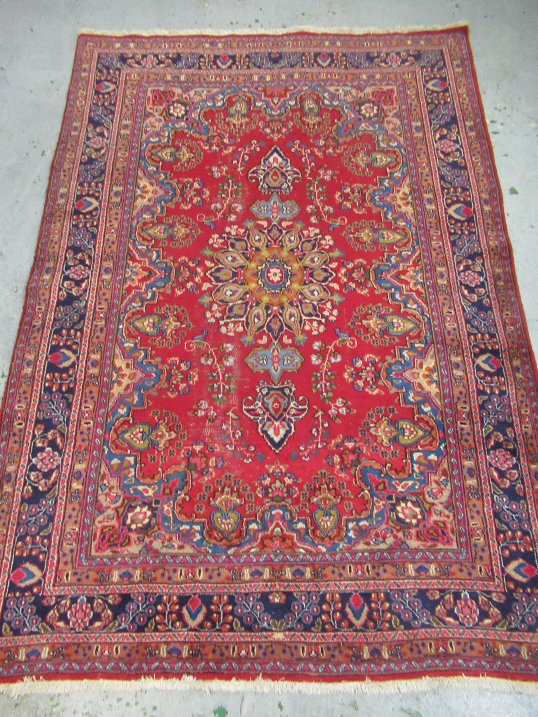 20th Century Turkish carpet of Persian design with a lobed medallion and all over floral pattern