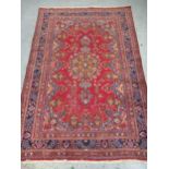 20th Century Turkish carpet of Persian design with a lobed medallion and all over floral pattern