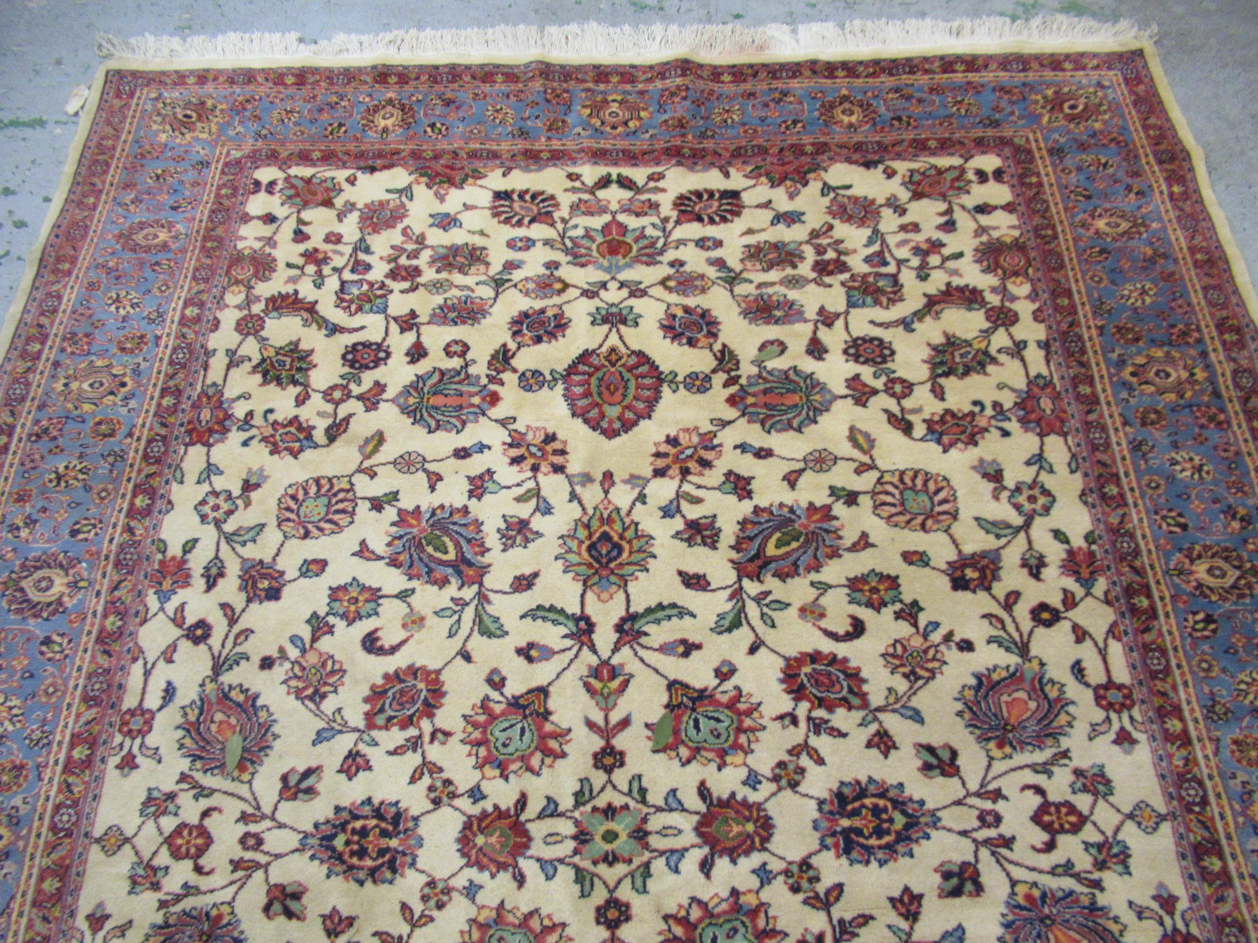 Indian carpet with an all over stylised floral design on ivory ground with pale blue borders, 140ins - Image 3 of 6