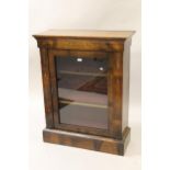 19th Century walnut and marquetry inlaid pier cabinet with a single glazed door enclosing shelves,