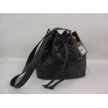Chanel black diamond quilted bucket bag with drawstring and shoulder strap, circa 1990's, with