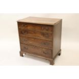 19th Century mahogany dwarf chest, having veneered moulded top above four graduated drawers , with