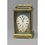 A 19TH CENTURY BRASS CASED CARRIAGE CLOCK, the rectangular enamelled dial with Roman Numerals and