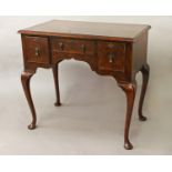 A QUEEN ANNE STYLE WALNUT LOWBOY, with a quarter veneered and crossbanded top above three small