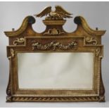 AN ELABORATE GEORGE II STYLE MIRROR IN THE MANNER OF WILLIAM KENT, the broad rectangular plate