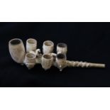 AN UNUSUAL ANTI DELUVIAN ORDER OF BUFFALOES MULTI-BOWLED PIPE, the stem leading to a central large