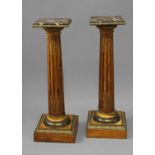 A PAIR OF LOUIS XVI STYLE MARBLE TOPPED COLUMNS, each with a 'rouge' marble top within a gilt metal