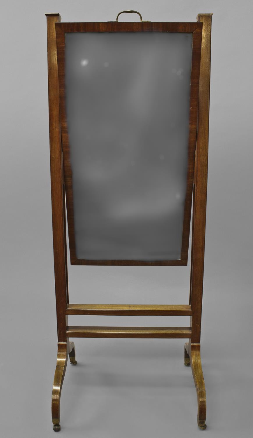 A LATE GEORGE III MAHOGANY FRAMED CHEVAL MIRROR, with a rising rectangular plate with bevelled edge,