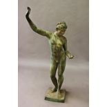 A CLASSICAL STYLE BRONZE STATUE OF A MALE FIGURE, the faun standing, naked, with one hand raised and