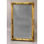 A REGENCY GILT FRAMED OVERMANTLE MIRROR, the rectangular plate within a gilt surround with floral