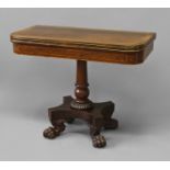 A REGENCY ROSEWOOD AND BRASS INLAID CARD TABLE, the 'D' shaped top with brass stringing and broad