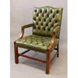 A GEORGE III STYLE GAINSBOROUGH TYPE ARMCHAIR, with green leather buttoned upholstery, the frame