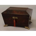 A REGENCY ROSEWOOD WORKBOX, of sarcophagus form with tapering sides, twin gilt ring handles and