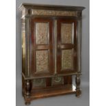 A LATE 19TH CENTURY COPPER MOUNTED CABINET, with a dark stained finish with broad moulded cornice