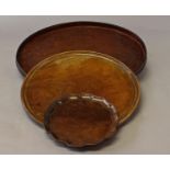 A GEORGE III STYLE MAHOGANY TRAY AND TWO OTHERS, A Chippendale style mahogany tray or waiter with