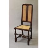 A WILLIAM AND MARY STYLE CANED WALNUT SIDE CHAIR, the back with a scrolling top rail above twin