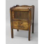 A GEORGE III MAHOGANY TAMBOUR FRONTED COMMODE, the rectangular top with wavy border with twin