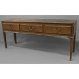 A GEORGE II OAK DRESSER BASE, the broad two plank top above three drawers with moulded edges and