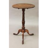 A GEORGE III PEARWOOD PEDESTAL TABLE, the circular tip-top on a vase and ring turned column with