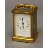 A GILT BRASS CASED CARRIAGE CLOCK, with a white enamelled dial indistinctly signed 'Thompson London'