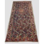 RARE KHAMSEH LONG RUG, South West Iran, second half 19thC. The indigo field with narrow columns of