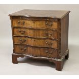 A GEORGE III STYLE MAHOGANY SERPENTINE FRONTED CHEST, the shaped top with a moulded border